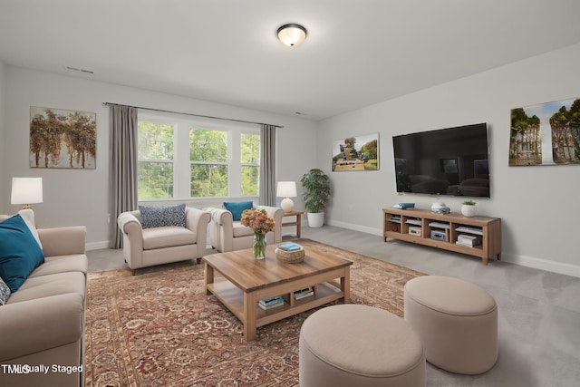 50 Gadwall Ct, Zebulon, NC 27597 - carpeted living room with baseboards and visible vents