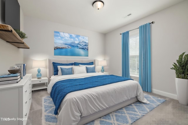 50 Gadwall Ct, Zebulon, NC 27597 - bedroom with baseboards, light carpet, and visible vents