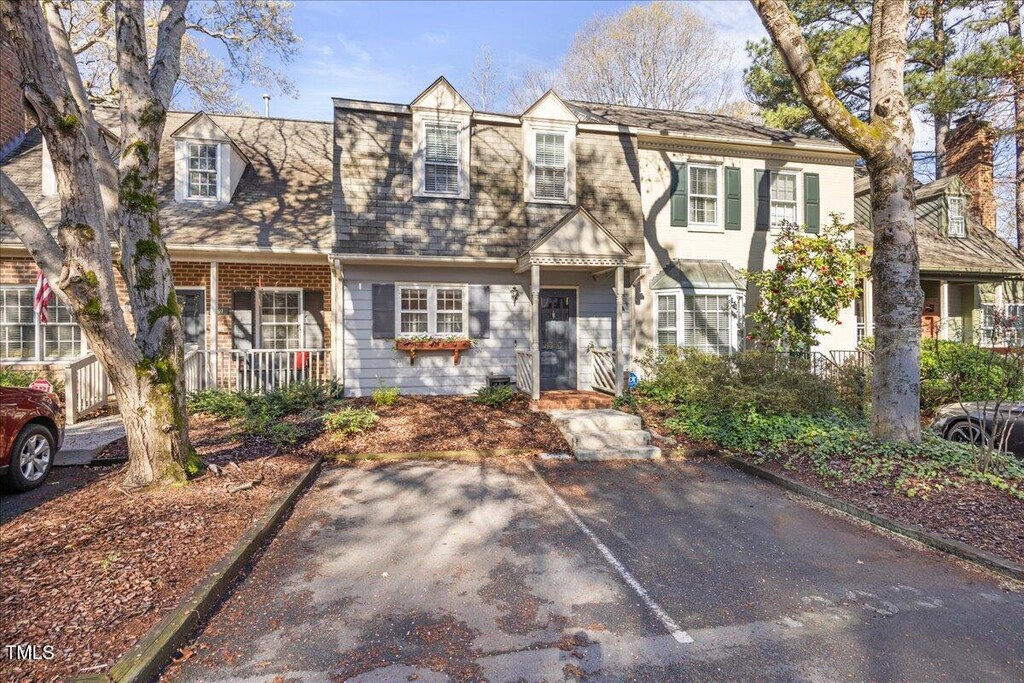 townhome / multi-family property with a porch