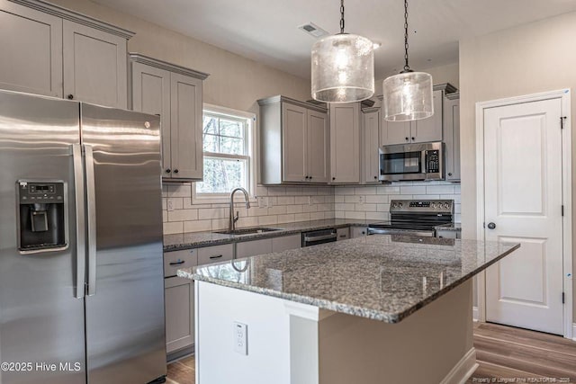 190 Love Grove Church Rd, West End, NC 27376 - kitchen with backsplash, gray cabinets, a sink, and stainless steel appliances