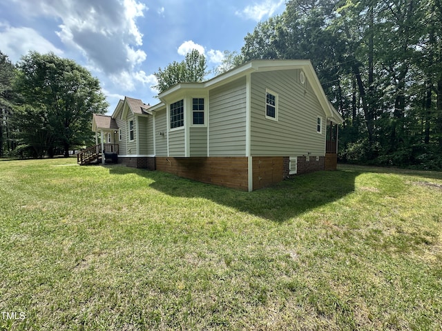 view of property exterior featuring a lawn