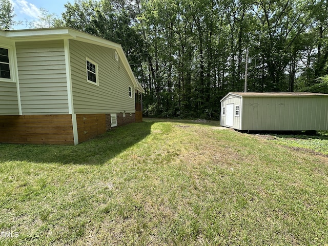 view of yard with an outdoor structure and a shed