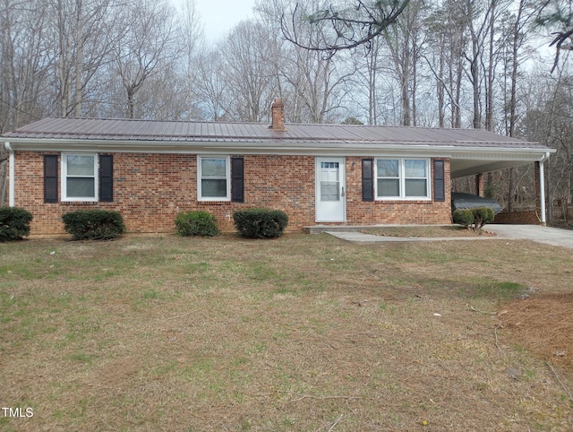 5774 NC Highway 86, Yanceyville, NC 27379 - single story home with a front lawn, metal roof, a carport, and brick siding
