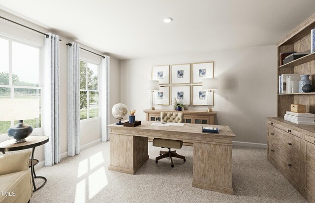 office featuring baseboards and light carpet