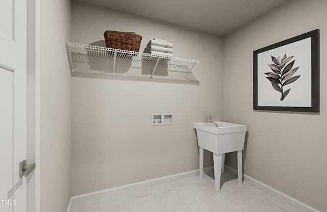 laundry area featuring baseboards, washer hookup, laundry area, and tile patterned floors