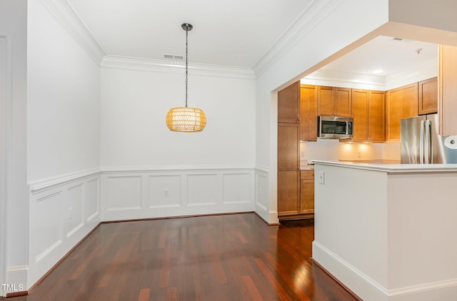 1310 Durlain Dr Unit 107, Raleigh, NC 27614 - kitchen featuring appliances with stainless steel finishes, dark wood-type flooring, ornamental molding, light countertops, and brown cabinets