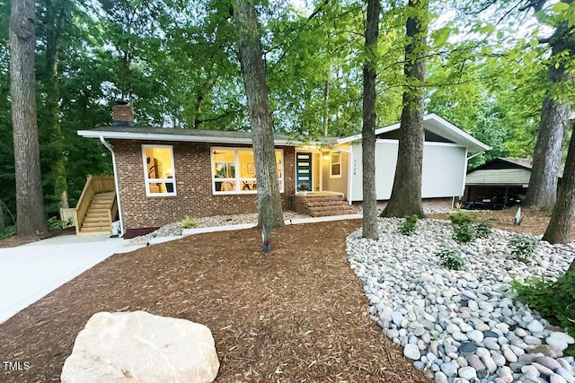 1124 Hardimont Rd, Raleigh, NC 27609 - ranch-style home with brick siding and a chimney