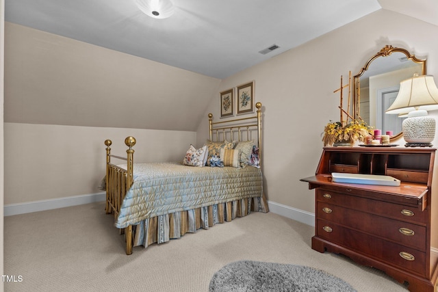 carpeted bedroom with baseboards, lofted ceiling, and visible vents