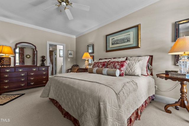 carpeted bedroom with baseboards, ornamental molding, and a ceiling fan