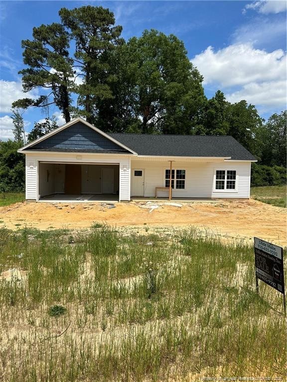 480 Dalton Dr, Lumber Bridge, NC 28357 - view of front of house featuring driveway and a garage