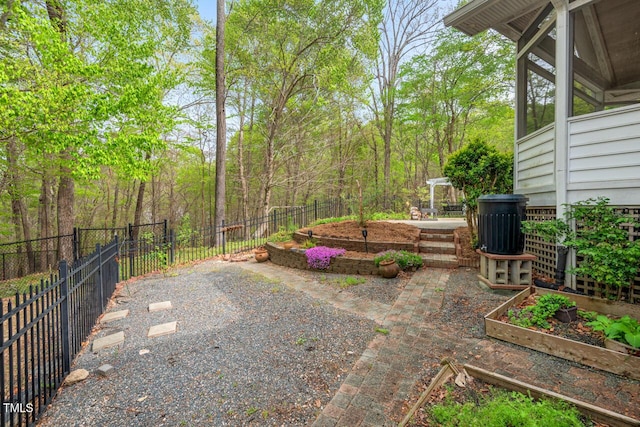 5900 Orchid Valley Rd, Raleigh, NC 27613 - fenced backyard featuring a garden and a patio