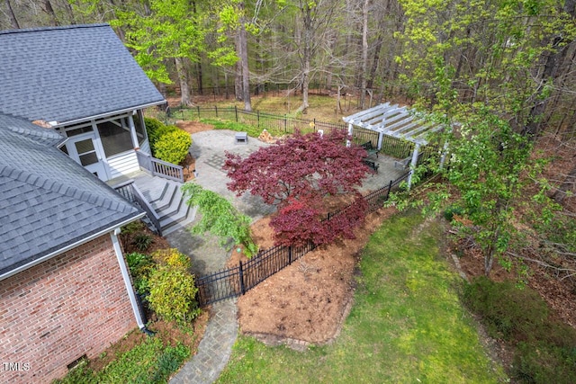 5900 Orchid Valley Rd, Raleigh, NC 27613 - fenced yard with a pergola, a forest view, and a patio area