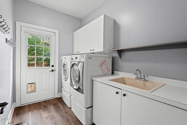 5900 Orchid Valley Rd, Raleigh, NC 27613 - washroom featuring cabinet space, washer and dryer, and dark wood finished floors