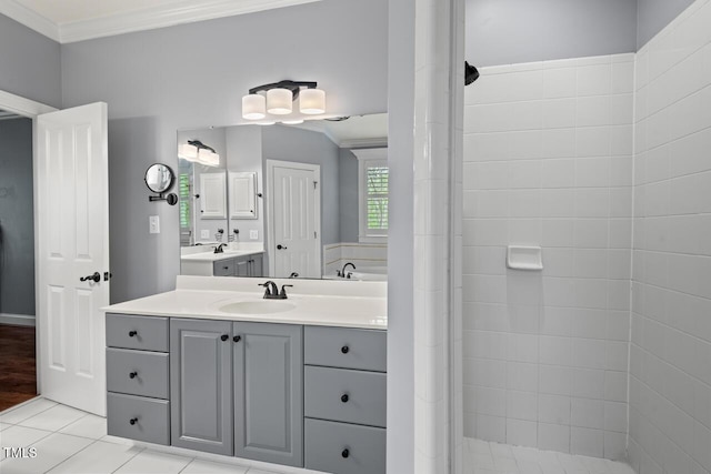 5900 Orchid Valley Rd, Raleigh, NC 27613 - bathroom featuring ornamental molding, vanity, a shower stall, a garden tub, and tile patterned floors