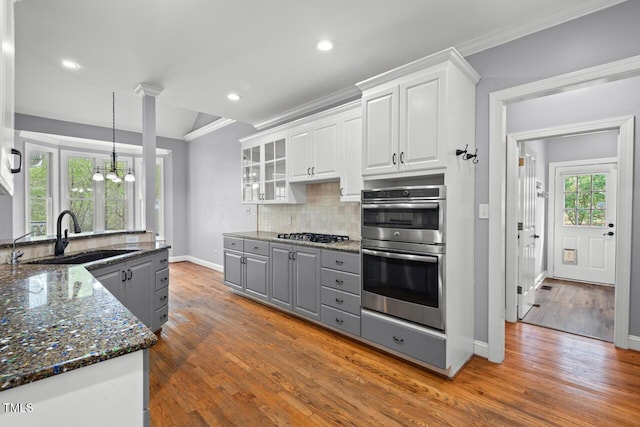 5900 Orchid Valley Rd, Raleigh, NC 27613 - kitchen featuring a sink, gray cabinetry, stainless steel appliances, wood finished floors, and white cabinetry