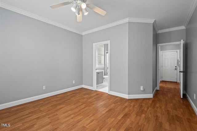 5900 Orchid Valley Rd, Raleigh, NC 27613 - unfurnished bedroom with wood finished floors, baseboards, crown molding, ensuite bath, and ceiling fan