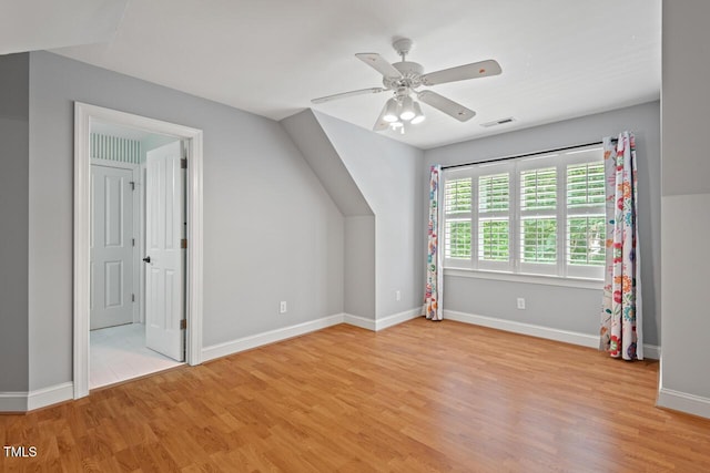 5900 Orchid Valley Rd, Raleigh, NC 27613 - additional living space with light wood-style floors, a ceiling fan, and baseboards