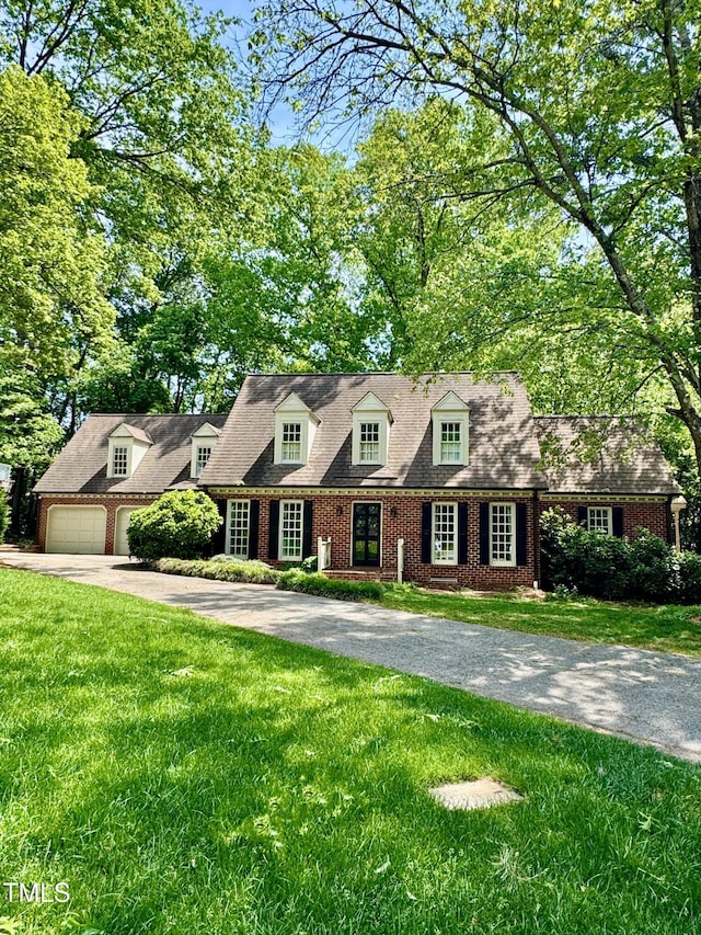 3005 Woodgreen Dr, Raleigh, NC 27607 - cape cod home featuring driveway and a front yard