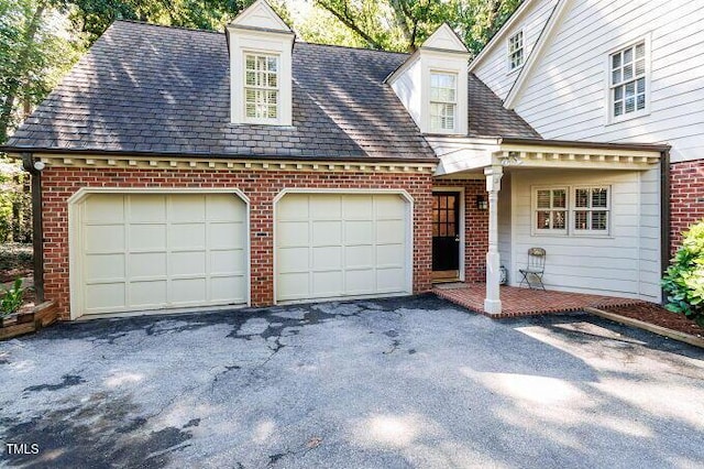 3005 Woodgreen Dr, Raleigh, NC 27607 - view of front of house featuring brick siding, a garage, and asphalt driveway
