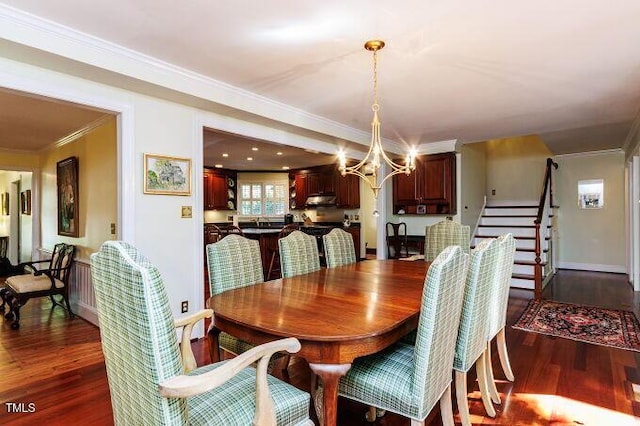 3005 Woodgreen Dr, Raleigh, NC 27607 - dining room with ornamental molding, dark wood-style floors, and a chandelier