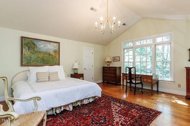 3005 Woodgreen Dr, Raleigh, NC 27607 - bedroom featuring a chandelier, wood finished floors, and vaulted ceiling