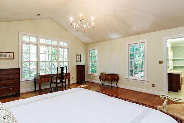 3005 Woodgreen Dr, Raleigh, NC 27607 - bedroom featuring wood finished floors, a chandelier, lofted ceiling, a desk, and connected bathroom