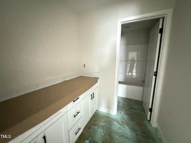 bathroom with concrete flooring