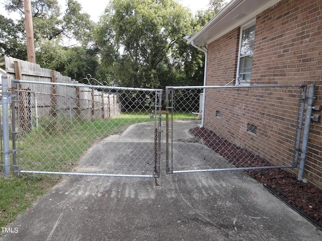 view of gate featuring fence