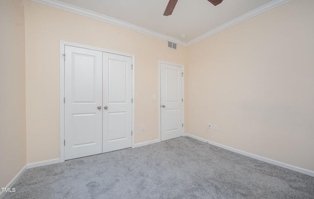 1030 Thoughtful Spot Ln, Durham, NC 27703 - unfurnished bedroom with crown molding, carpet, baseboards, a closet, and a ceiling fan