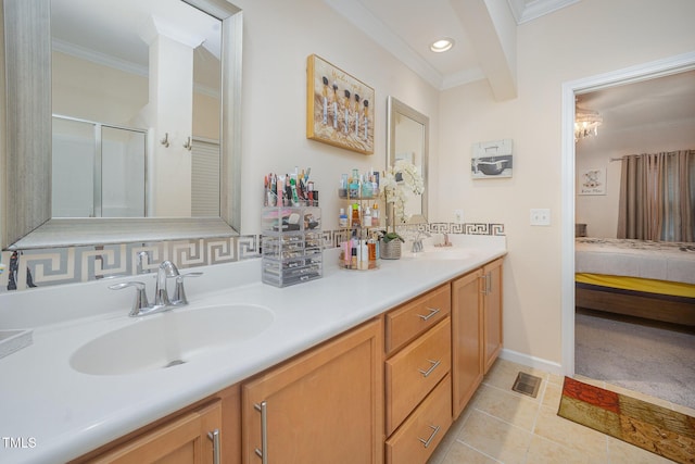 1030 Thoughtful Spot Ln, Durham, NC 27703 - ensuite bathroom featuring ornamental molding, a stall shower, double vanity, tile patterned flooring, and recessed lighting