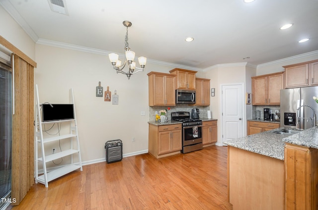 1030 Thoughtful Spot Ln, Durham, NC 27703 - kitchen featuring stainless steel appliances, backsplash, a chandelier, ornamental molding, and light wood finished floors