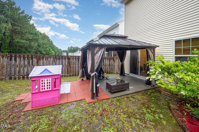 1030 Thoughtful Spot Ln, Durham, NC 27703 - view of patio with a gazebo and a fenced backyard