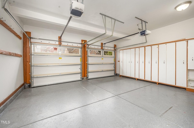 1030 Thoughtful Spot Ln, Durham, NC 27703 - garage featuring a garage door opener and baseboards