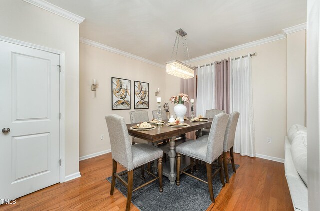 1030 Thoughtful Spot Ln, Durham, NC 27703 - dining space with light wood-type flooring, ornamental molding, and baseboards