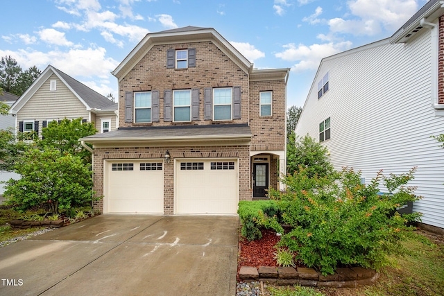 1030 Thoughtful Spot Ln, Durham, NC 27703 - view of front of property with brick siding, an attached garage, and driveway