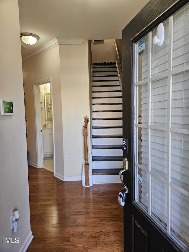 1030 Thoughtful Spot Ln, Durham, NC 27703 - foyer entrance featuring crown molding, wood finished floors, stairs, and baseboards