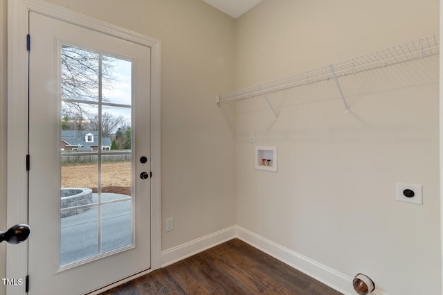 laundry area featuring hookup for a washing machine, hookup for an electric dryer, laundry area, baseboards, and dark wood-style flooring