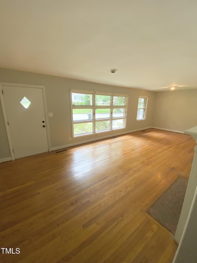1115 Park Ave, Henderson, NC 27536 - unfurnished living room with wood finished floors and baseboards