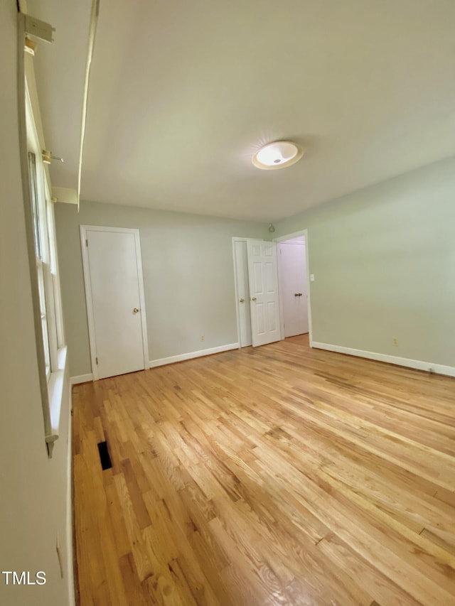 1115 Park Ave, Henderson, NC 27536 - empty room featuring light wood-type flooring and baseboards