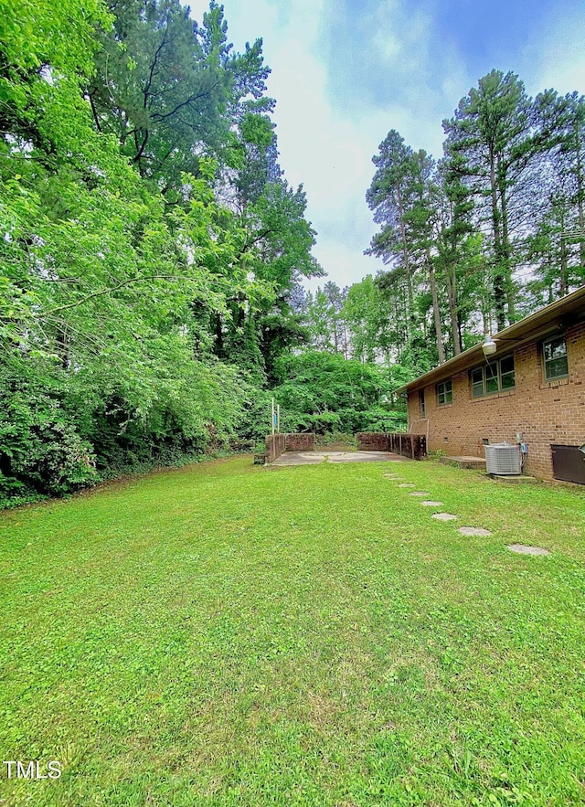 1115 Park Ave, Henderson, NC 27536 - view of green lawn with central AC unit