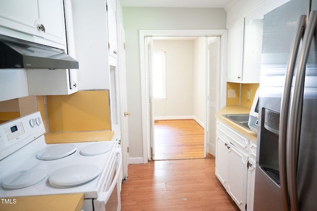 1115 Park Ave, Henderson, NC 27536 - kitchen featuring stainless steel refrigerator with ice dispenser, white range with electric cooktop, under cabinet range hood, light wood-style floors, and white cabinetry