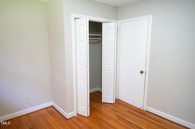 1115 Park Ave, Henderson, NC 27536 - unfurnished bedroom featuring light wood-style flooring and a closet