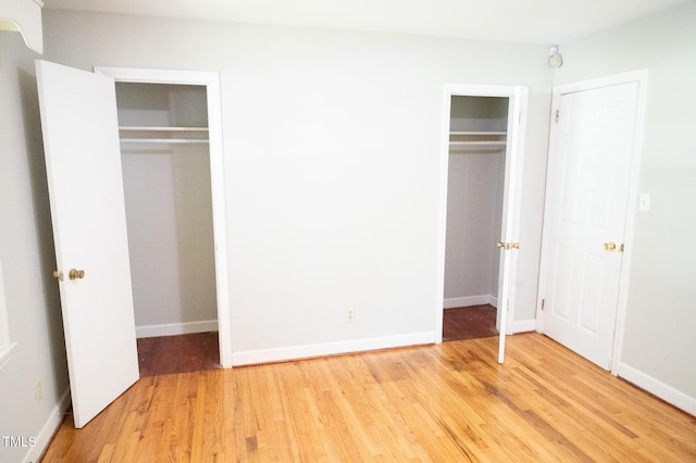 1115 Park Ave, Henderson, NC 27536 - unfurnished bedroom with light wood-style floors and baseboards