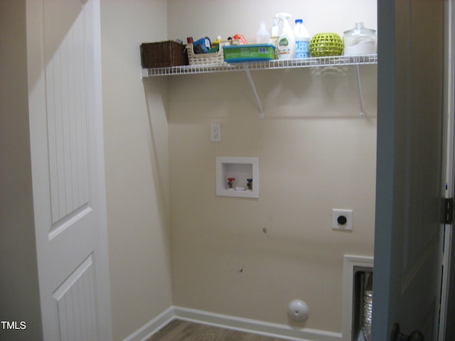 clothes washing area with electric dryer hookup, hookup for a washing machine, gas dryer hookup, wood finished floors, and baseboards