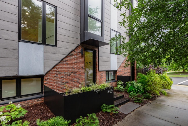 entrance to property with brick siding