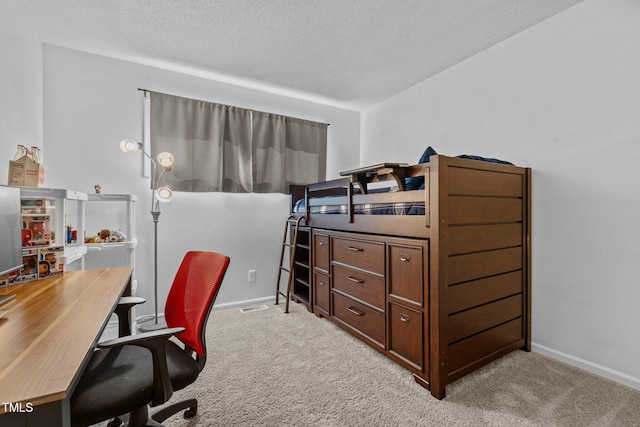 1801 Irish Blvd, Sanford, NC 27332 - bedroom featuring a textured ceiling, baseboards, and light carpet