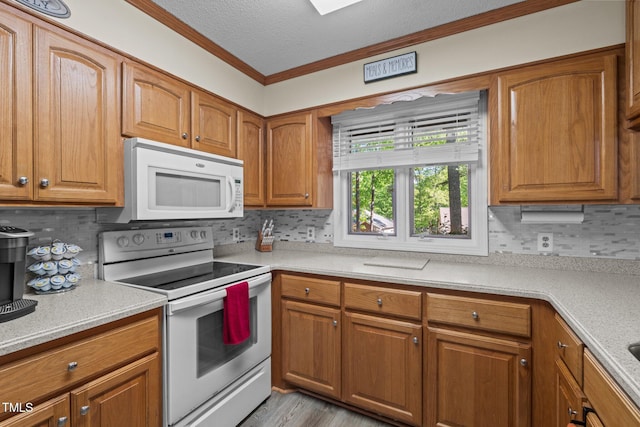 1801 Irish Blvd, Sanford, NC 27332 - kitchen with crown molding, tasteful backsplash, and white appliances