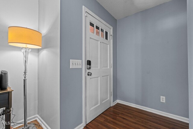 1801 Irish Blvd, Sanford, NC 27332 - entrance foyer with baseboards, a textured ceiling, and dark wood-type flooring