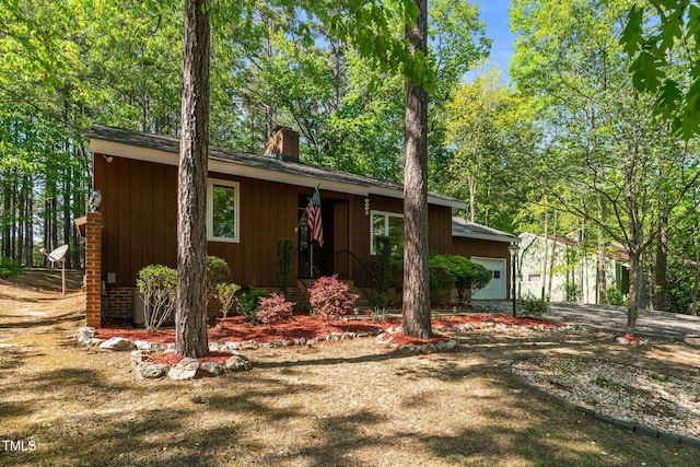 1801 Irish Blvd, Sanford, NC 27332 - ranch-style house featuring a garage, driveway, and a chimney