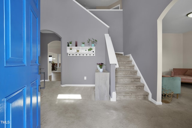 5824 Lady Way, Hope Mills, NC 28348 - entrance foyer featuring stairs, arched walkways, carpet floors, and baseboards